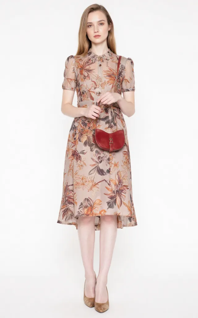 A French female model wearing Retro   inspired   style clothing, against a white background, in a front   facing shot focusing on shoes